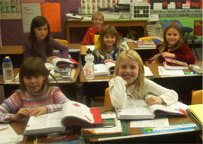 girl with dictionary smiling